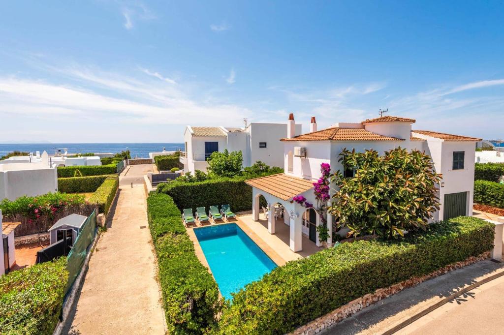 an aerial view of a villa with a swimming pool at Villa Sunflower by Villa Plus in Cala Blanca