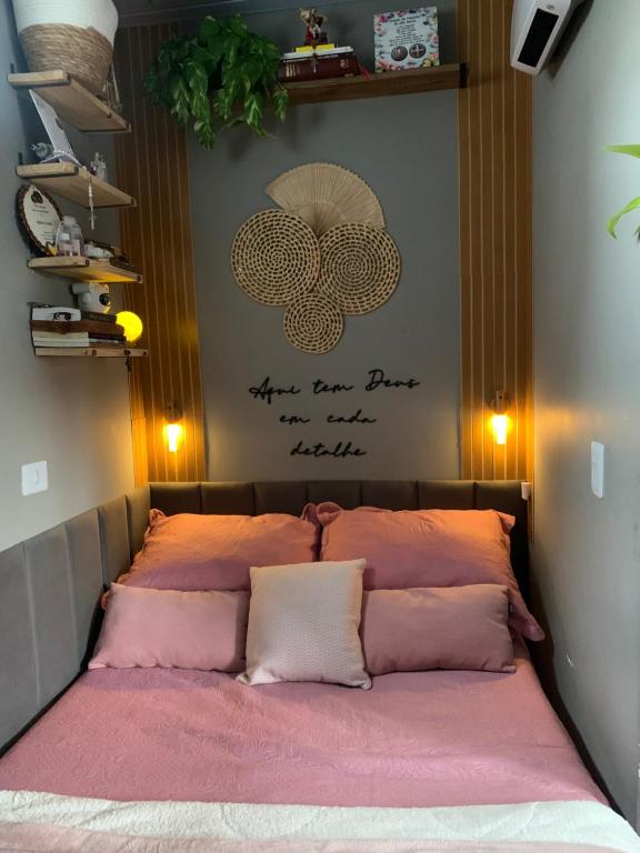Postel nebo postele na pokoji v ubytování Miniapartamento xaxim 2