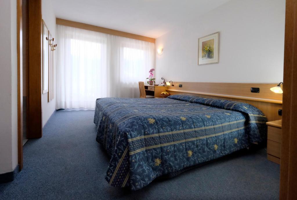 Postel nebo postele na pokoji v ubytování Albergo Antico