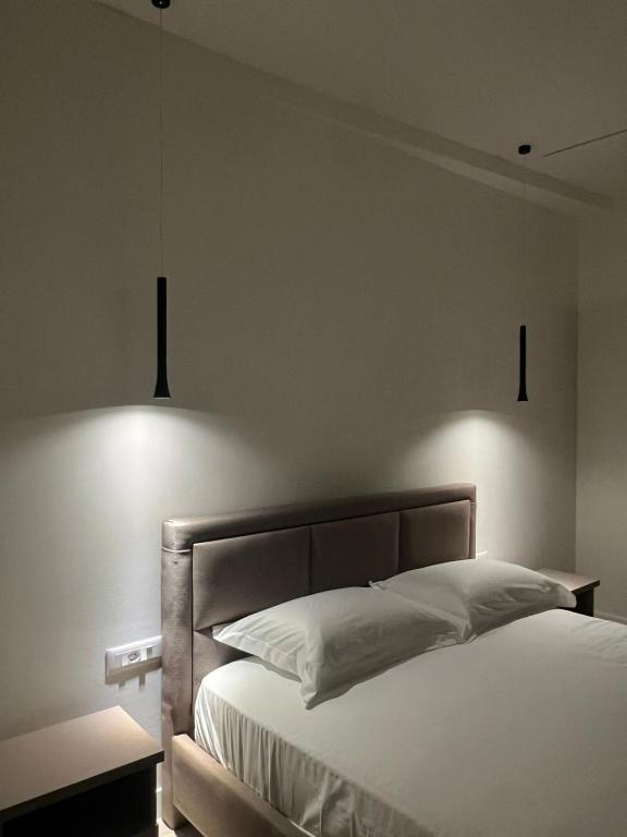 Ένα ή περισσότερα κρεβάτια σε δωμάτιο στο Hotel Gramozi