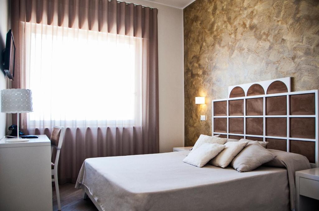 Posteľ alebo postele v izbe v ubytovaní B&B Ghalà