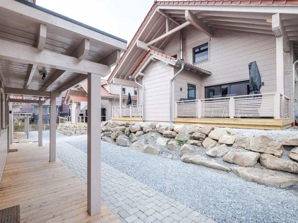 a house with a stone walkway in front of it at Mountain Forest Chalet Comfort 4 in Schierke