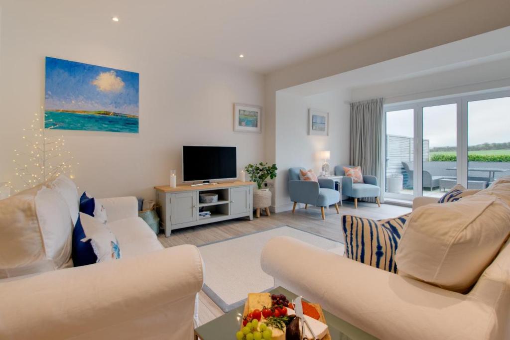 Televiisor ja/või meelelahutuskeskus majutusasutuses Urchins Peak