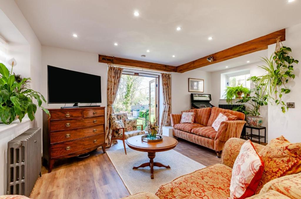 Televiisor ja/või meelelahutuskeskus majutusasutuses Gazen View Cottage