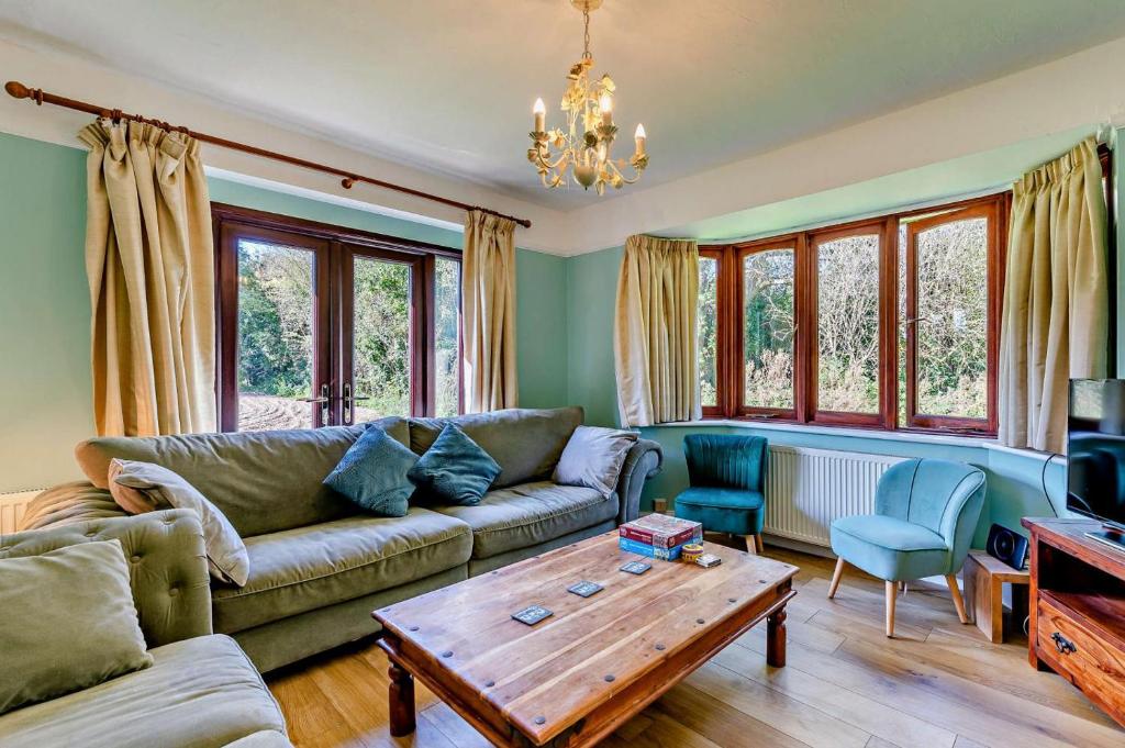 a living room with a couch and a coffee table at Willow House - Dymchurch in Dymchurch