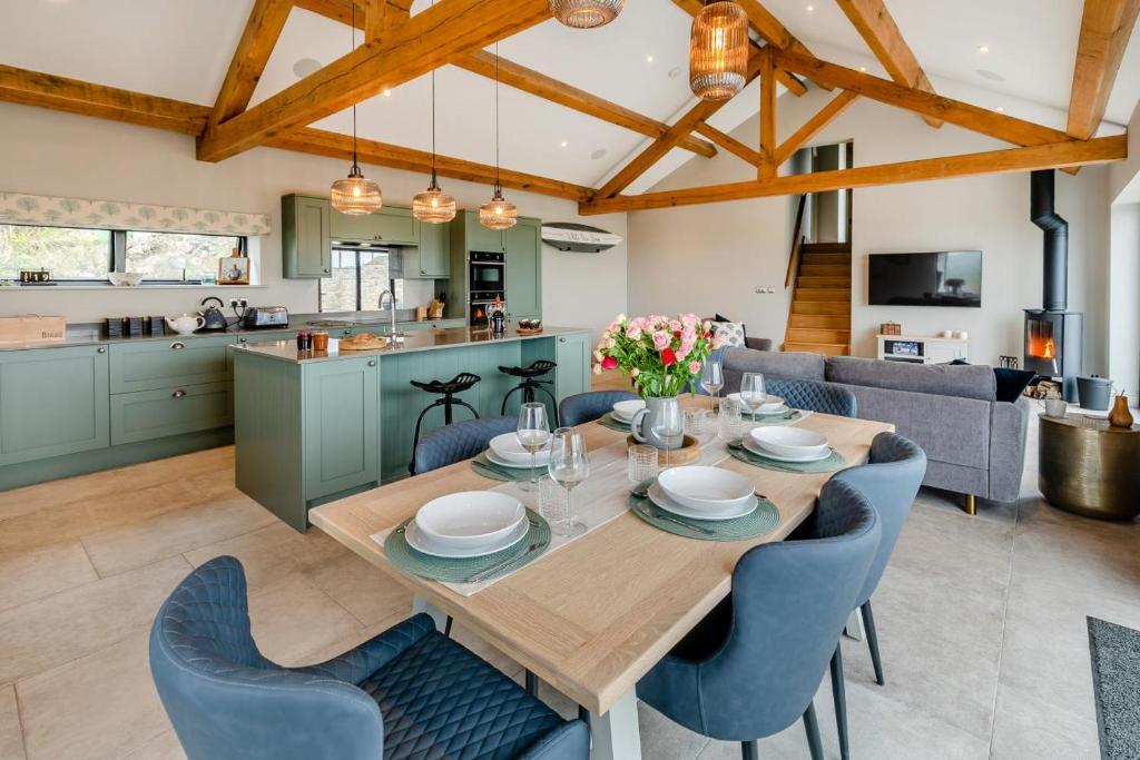 a kitchen and dining room with a wooden table and chairs at 3 Bed in Wendron oc-w29093 in Wendron