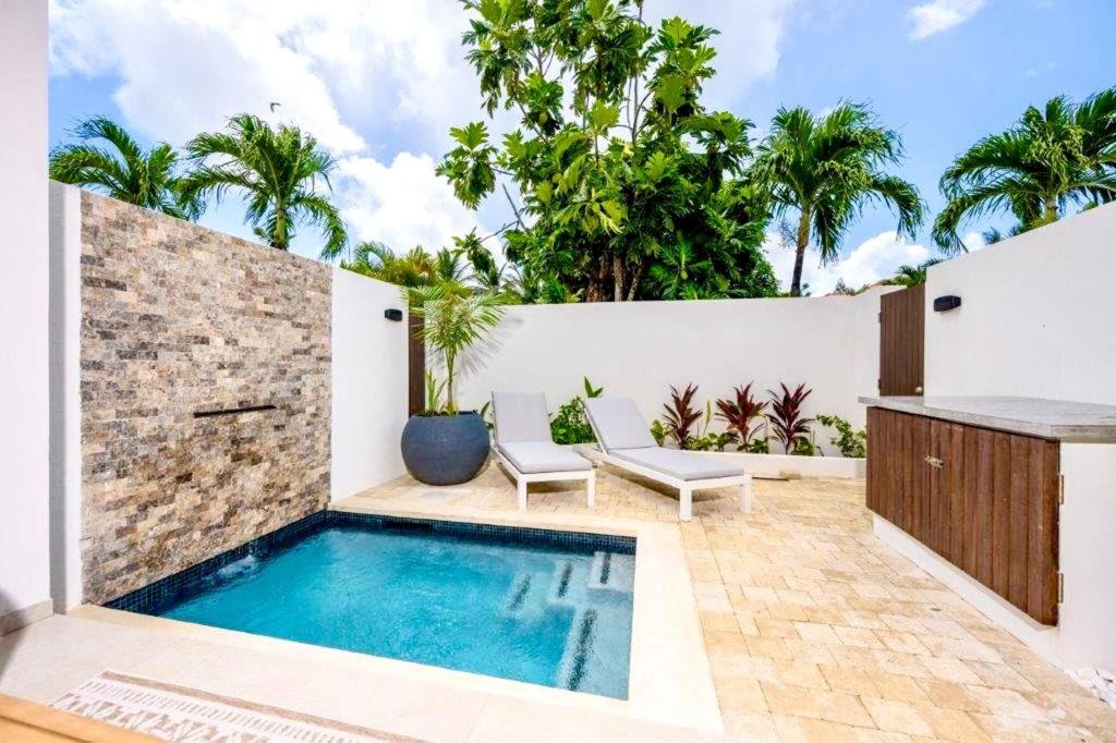 a pool in the backyard of a villa at ZenBreak Azzurro 9, 2bd in Saint James