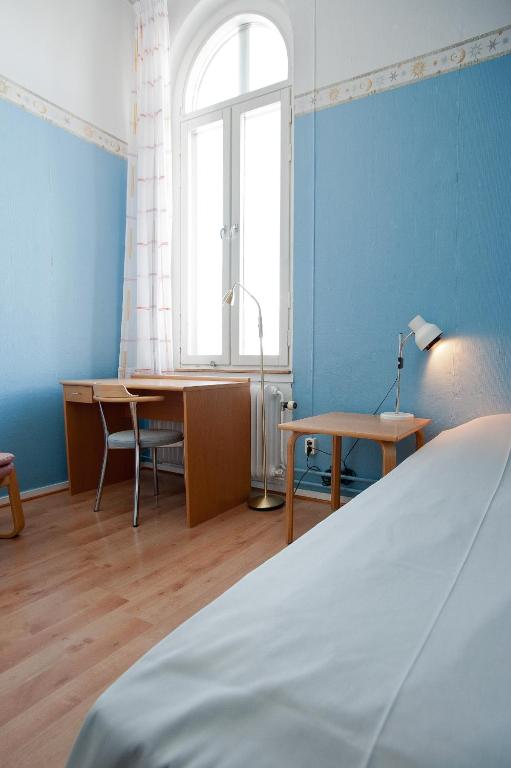 Postel nebo postele na pokoji v ubytování Hellidens Slott
