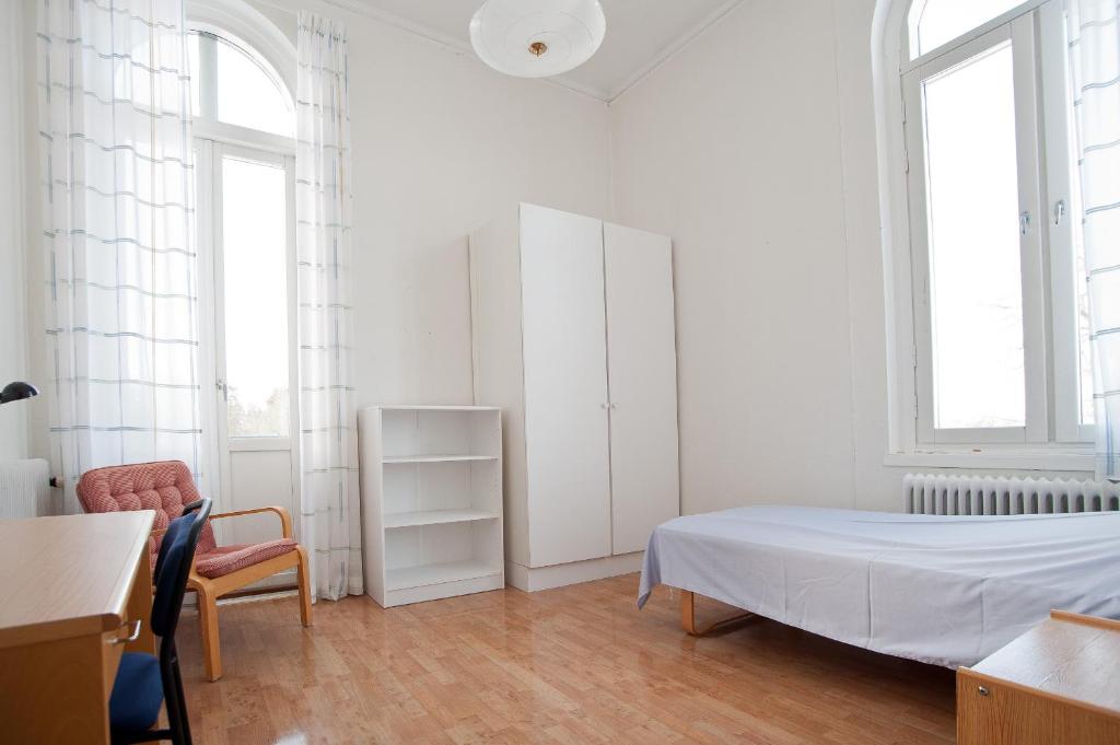 Postel nebo postele na pokoji v ubytování Hellidens Slott