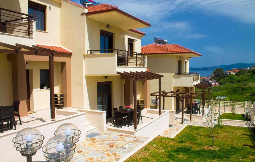 a villa with a view of the ocean at Ianthi Maisonettes in Nea Roda