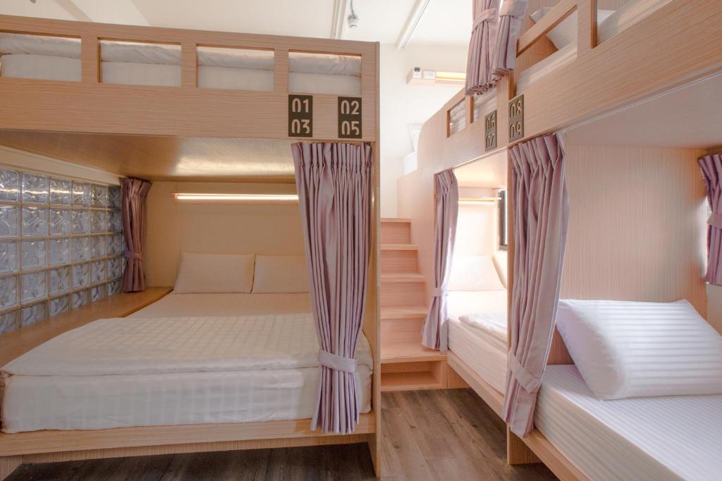 Postel nebo postele na pokoji v ubytování Fun Inn Taipei Hostel