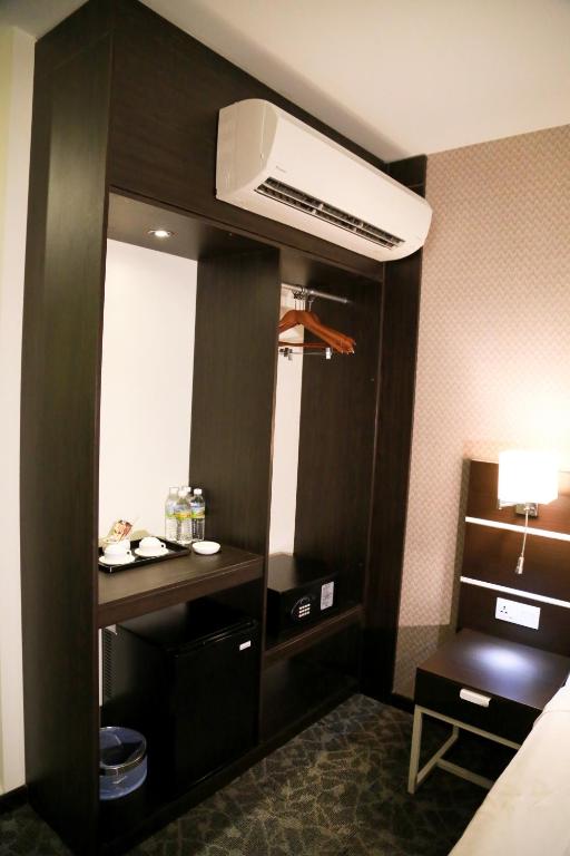 Postel nebo postele na pokoji v ubytování K Garden Hotel Parit Buntar