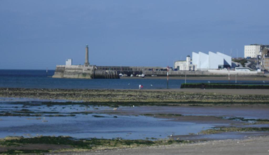 a body of water with a city in the background at Andorinho Sea View Apartment in Margate