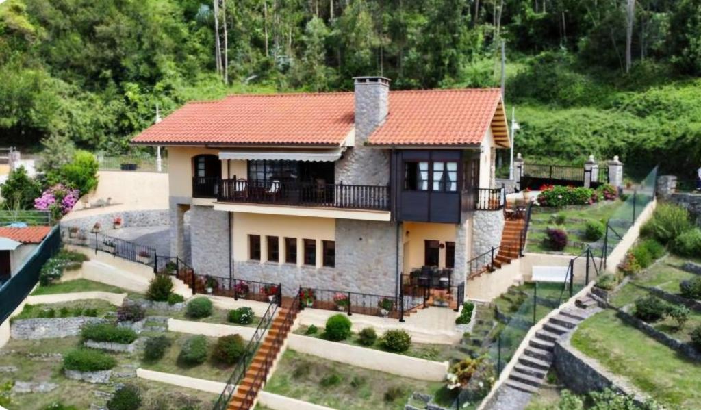 a model of a house with a red roof at Casa Villadam in Ribadesella