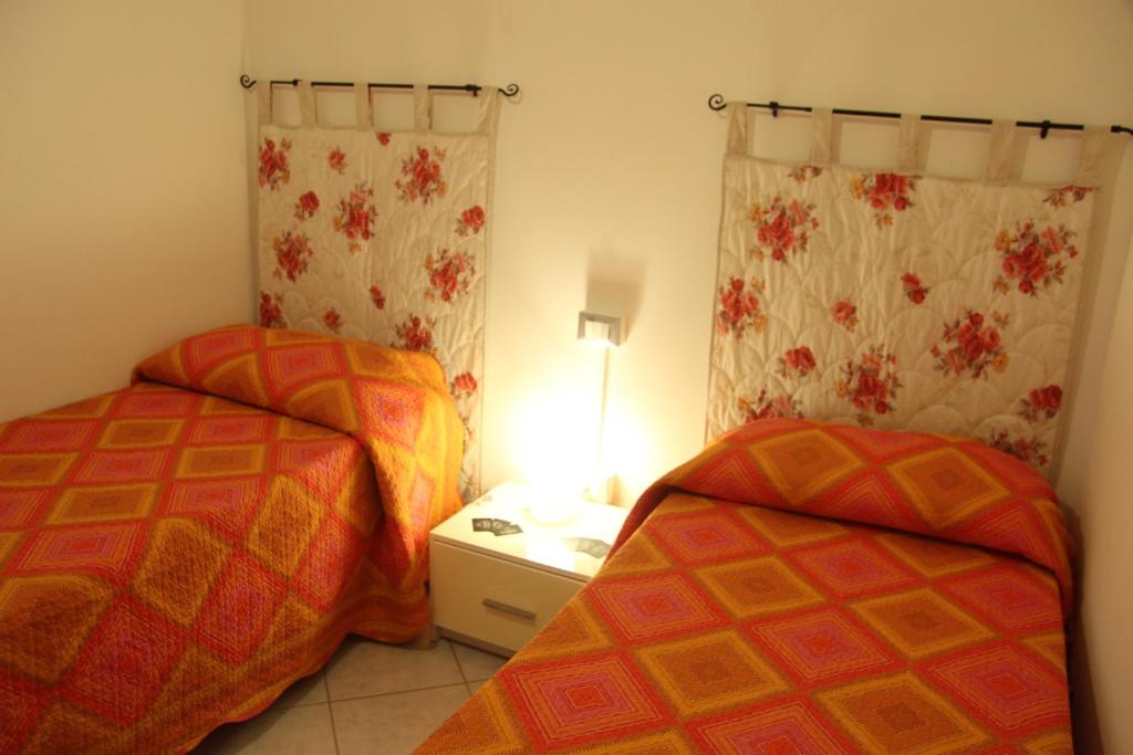 Postel nebo postele na pokoji v ubytování B&B Villa Ermanna