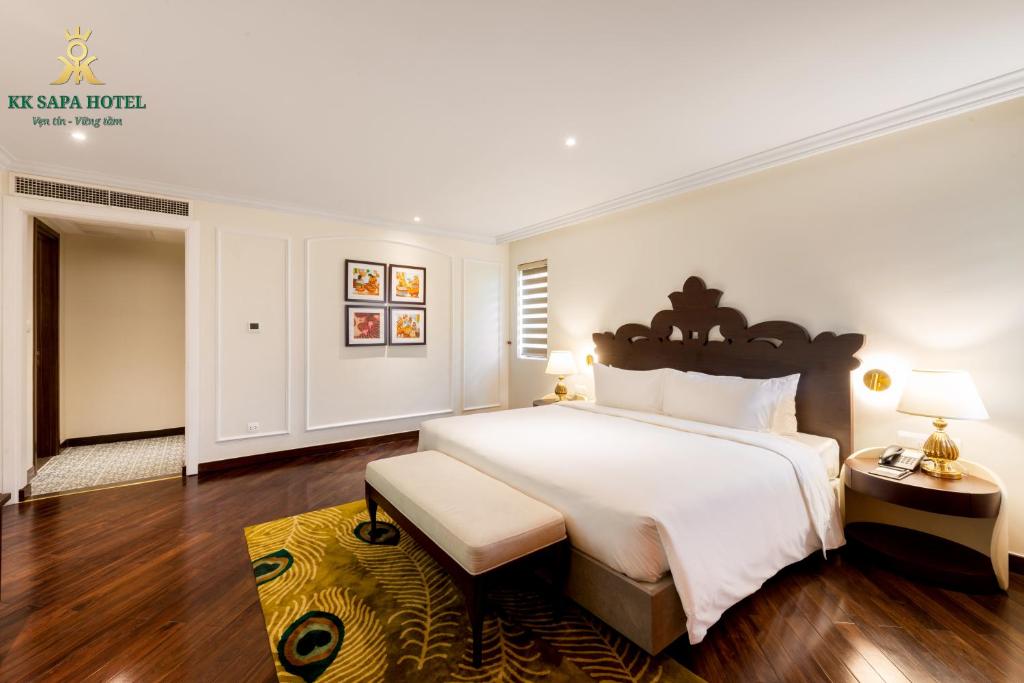 Giường trong phòng chung tại KK Sapa Hotel