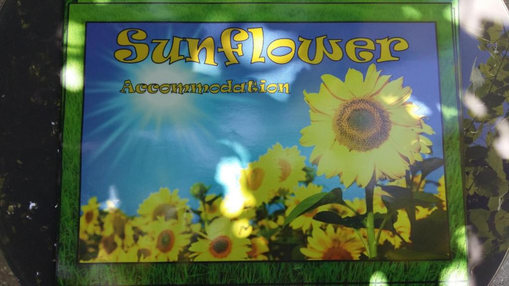 un libro de girasoles está en una mesa en Sunflower Accommodation, en Liubliana