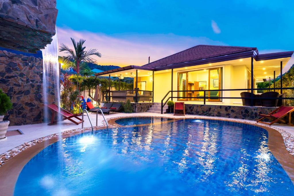 a swimming pool in front of a house at Arabella Ao Nang Private Pool Villa in Ao Nang Beach