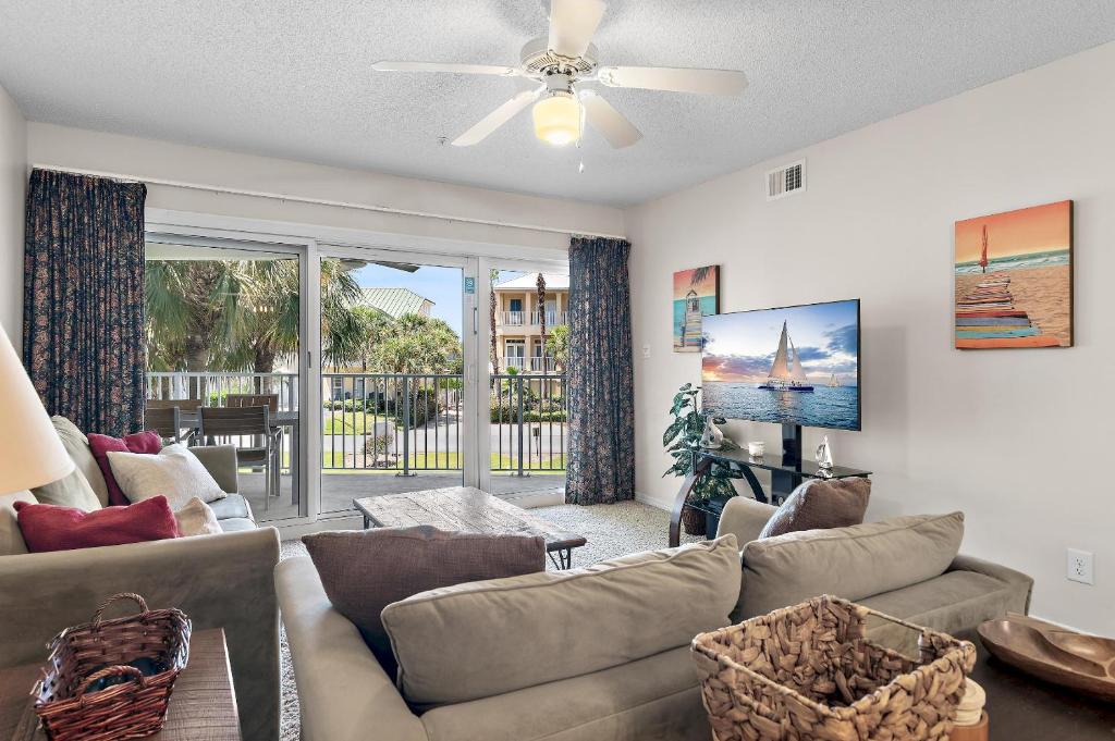 a living room with a couch and a ceiling fan at Maravilla 3202 in Destin