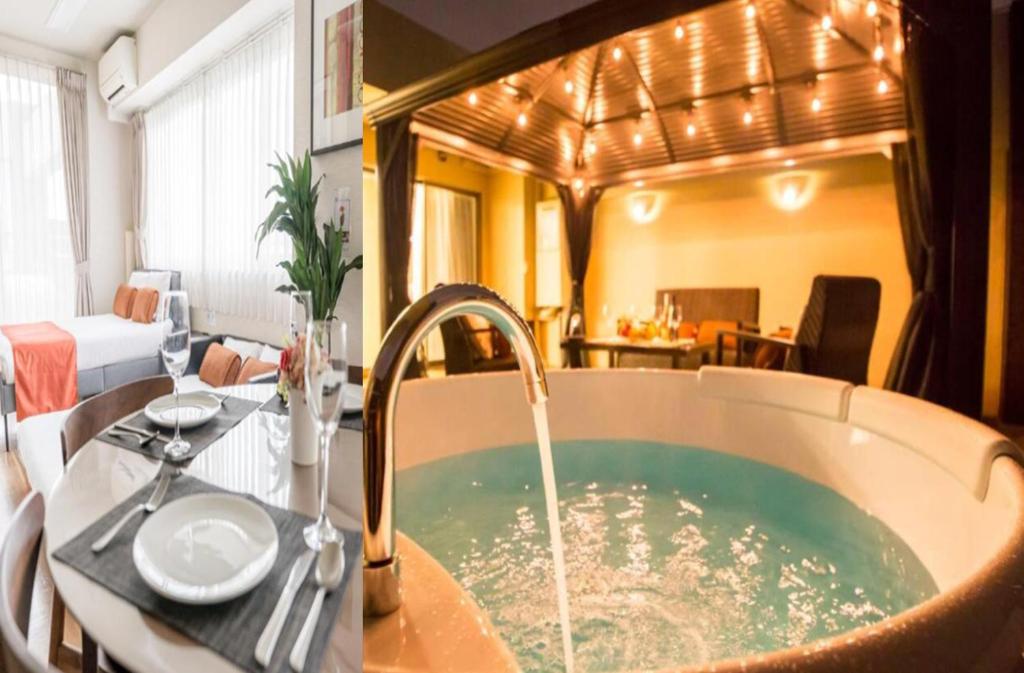 a bathroom with a bath tub with a sink at Oshiage Sky View Terrace Penthouse - brand new Hot Tab installed July 2025- in Tokyo