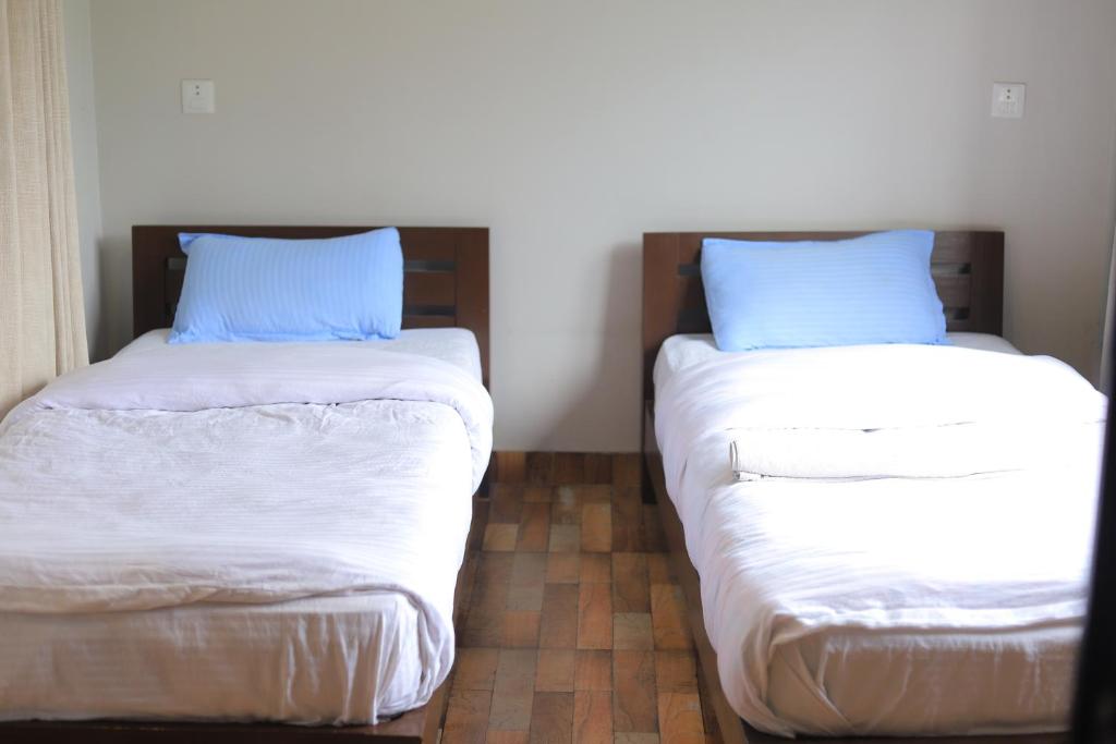 Ein Bett oder Betten in einem Zimmer der Unterkunft Hotel RB Lake