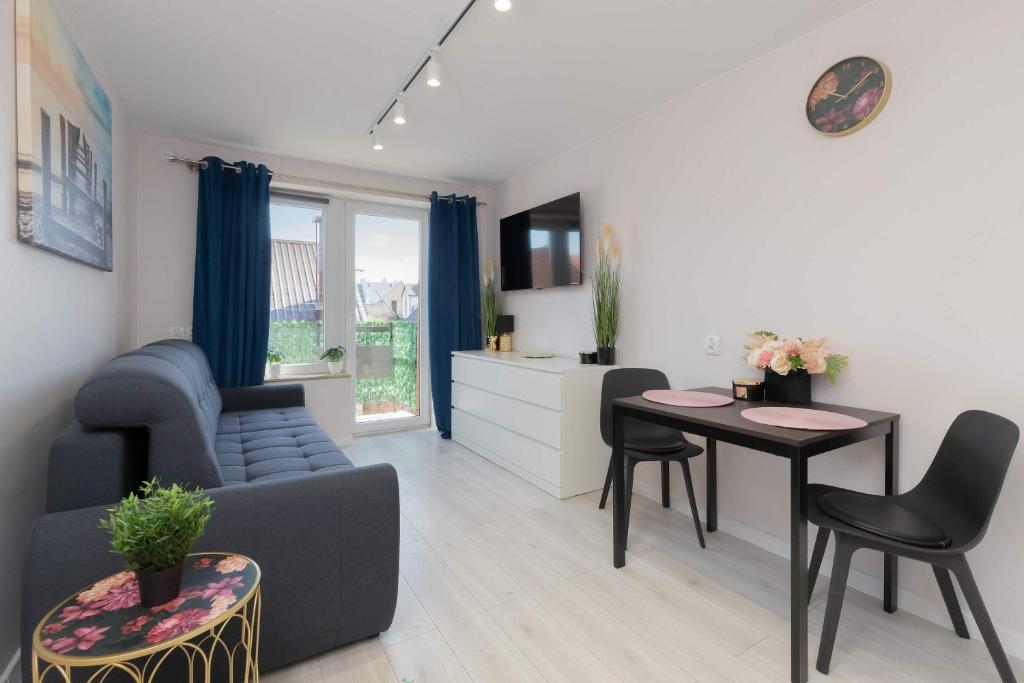 Posezení v ubytování Stylowe Studio w Łebie z Parkingiem by Noclegi Renters