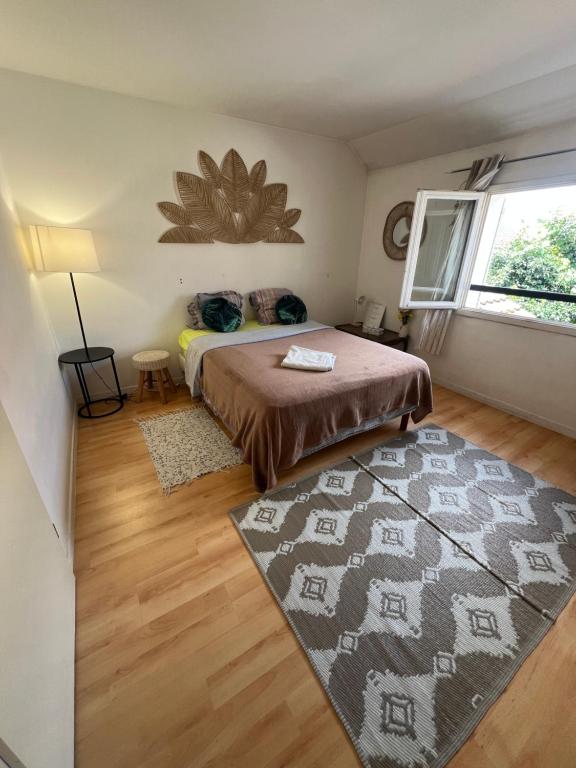 a bedroom with a bed and a rug at Roissy CDG, private room 1 in Roissy-en-France