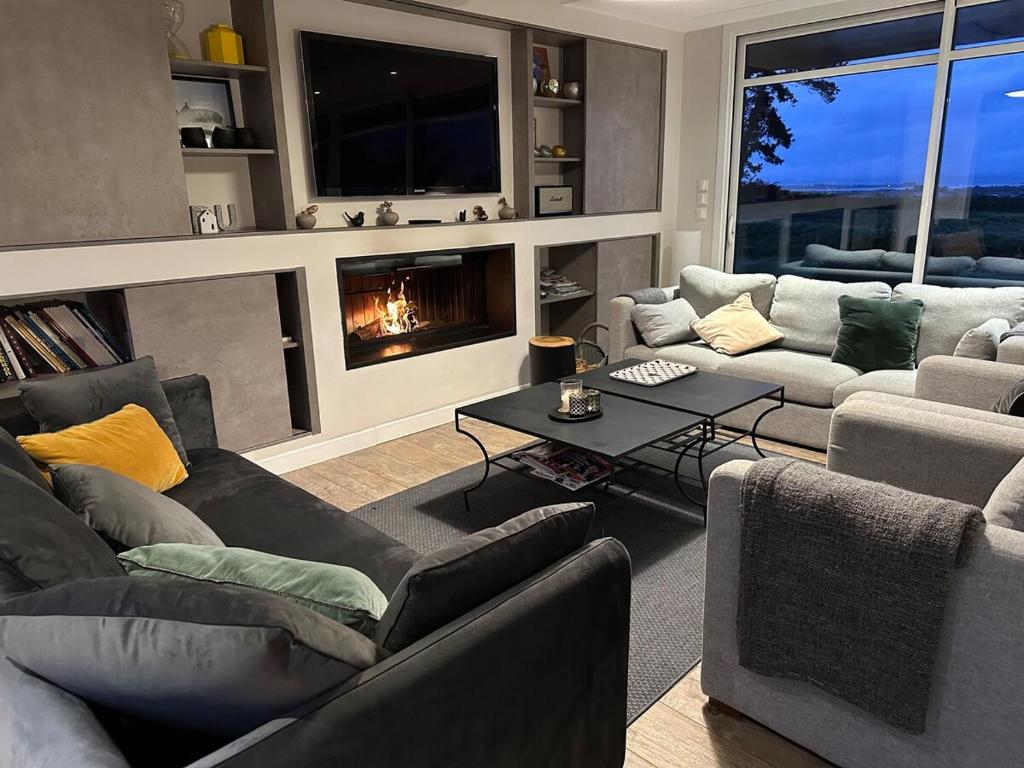 Χώρος καθιστικού στο TI DU, villa luxueuse avec vue panoramique - 4 chambres et 3 salles de bain, pour 8 personnes