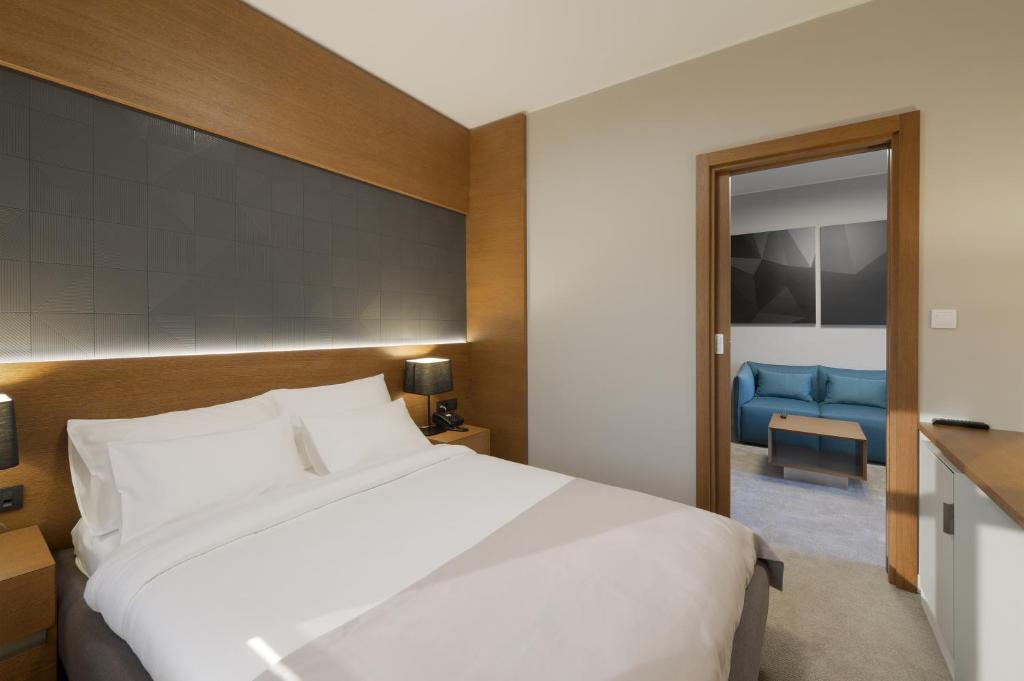 Postel nebo postele na pokoji v ubytování Hotel Orasac Garni