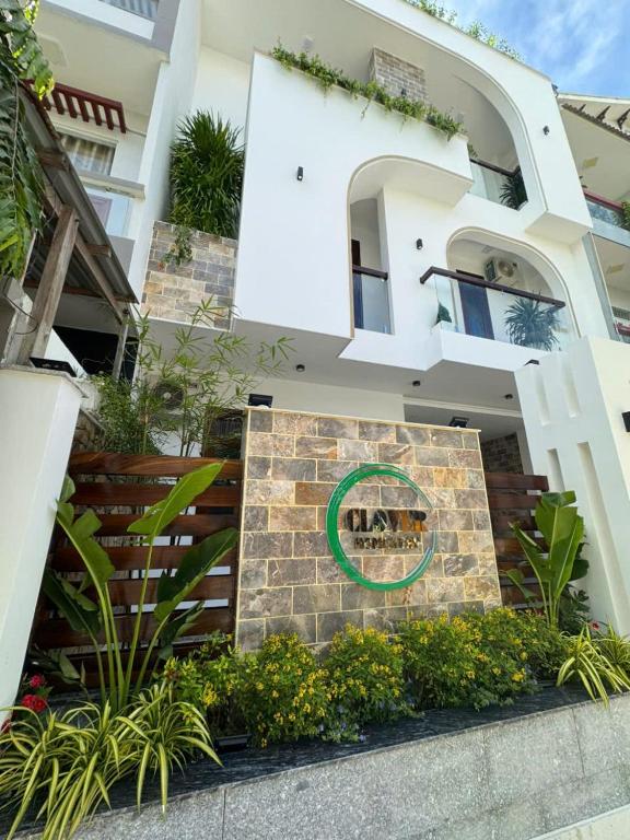 a house with a sign in front of it at CLOVER Homestay Phú Yên in Phường Sáu