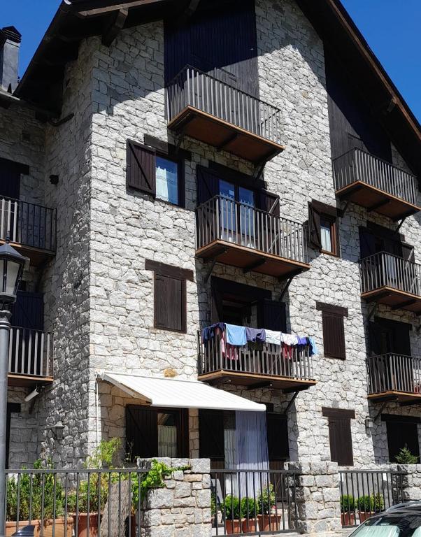 a building with clothes drying on the balconies of it at Apartamentos Nogueret in Benasque