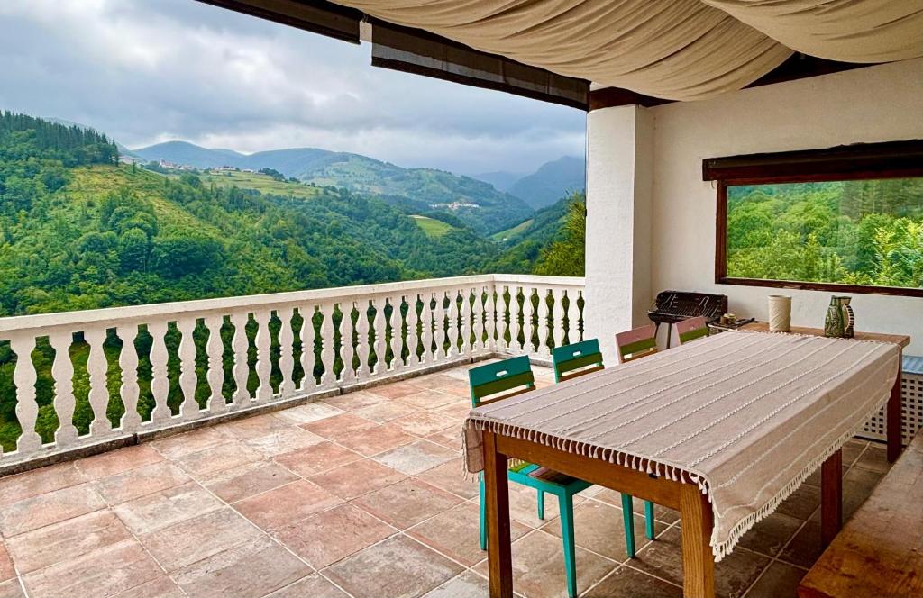 a table and chairs on a balcony with a view at Casa Rural - La Tregua 