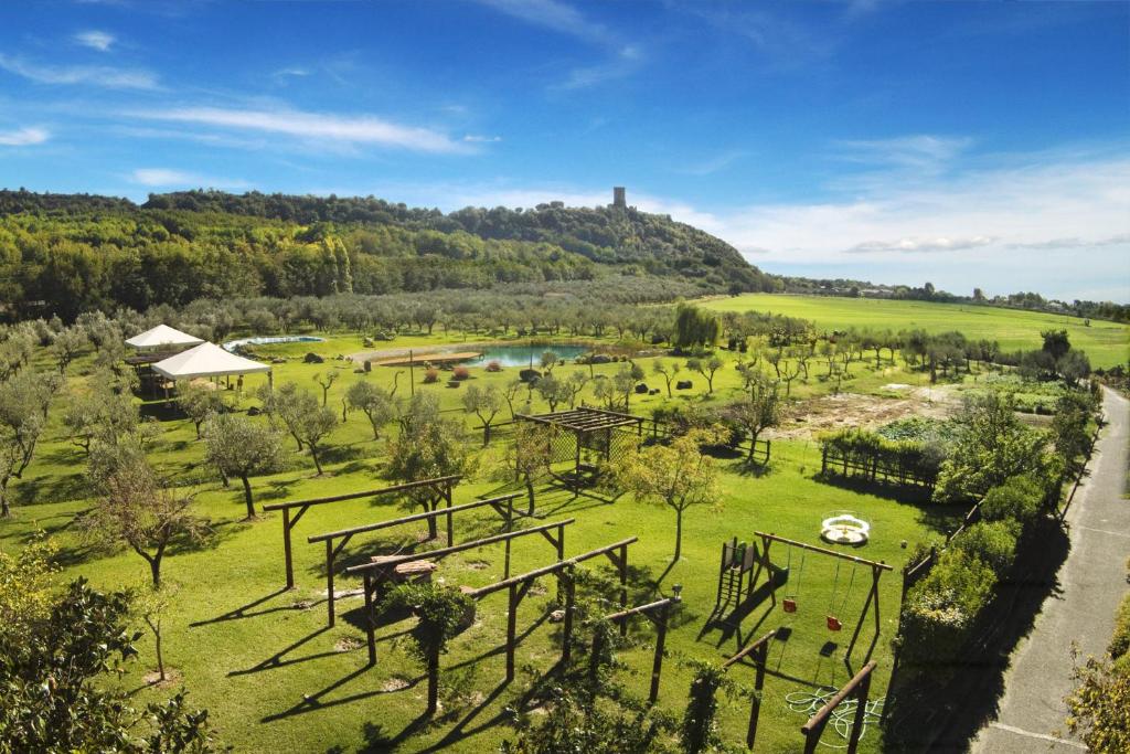 an aerial view of a park with a hill in the background at Iscairia Country House in Ascea
