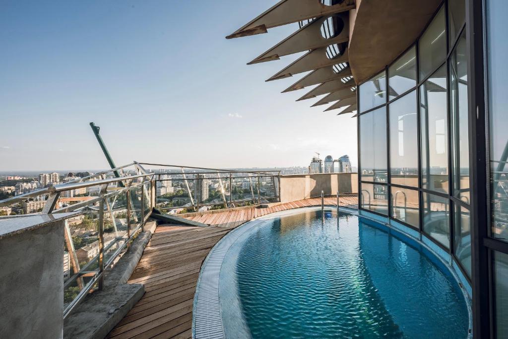 a swimming pool on the roof of a building at Апартаменты RoofPort in Kyiv