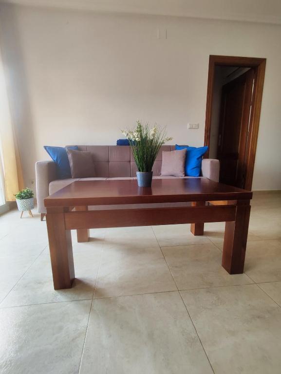 a wooden coffee table in a living room with a couch at Brisa Azul in Playas de Vera