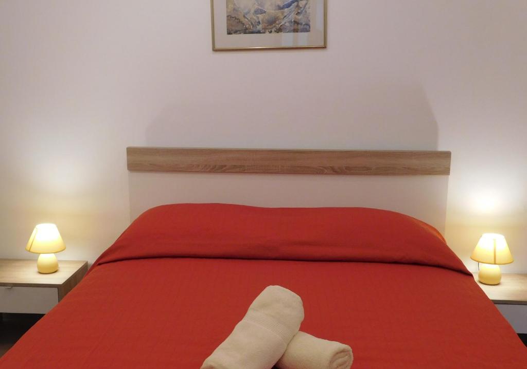 Postel nebo postele na pokoji v ubytování Central Apartments Circolo