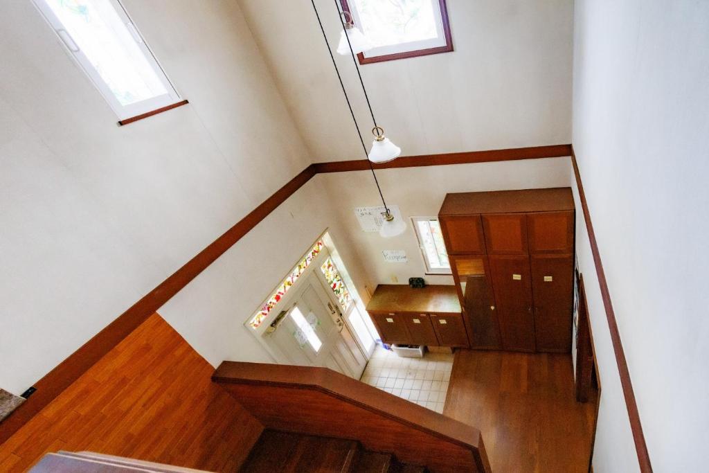 a staircase in a house with two windows at Ashigarashimogun - House - Vacation STAY 19327 in Mongawa