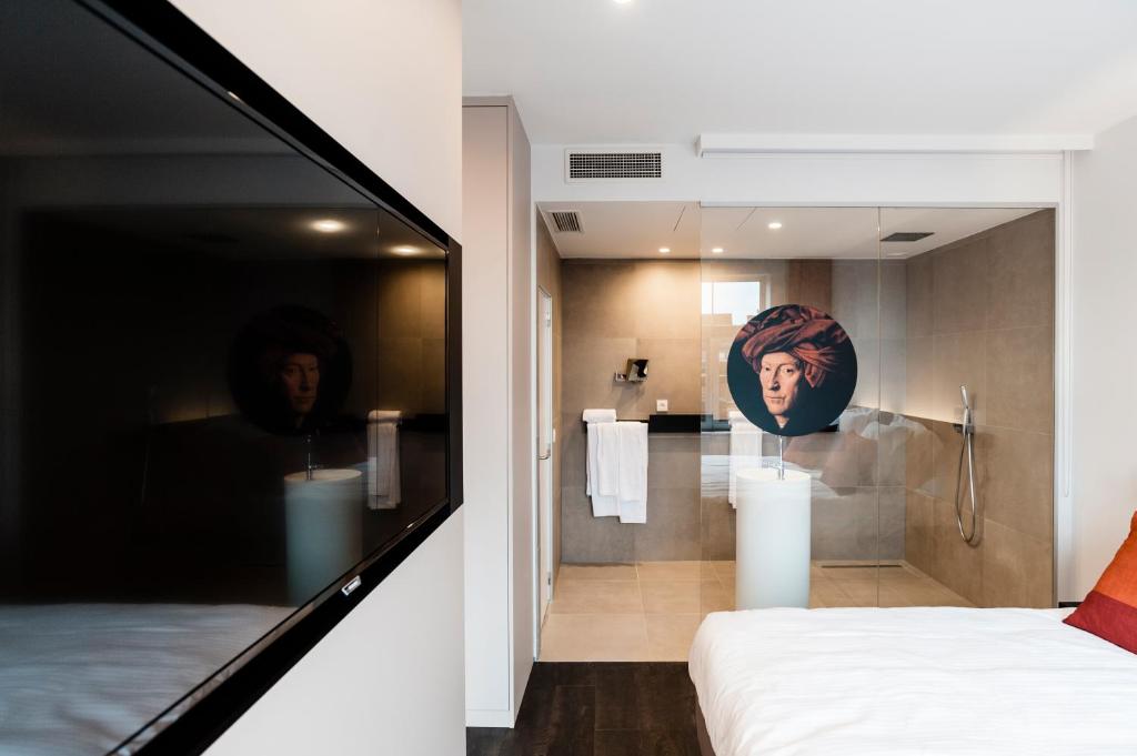Postel nebo postele na pokoji v ubytování Hotel Portinari