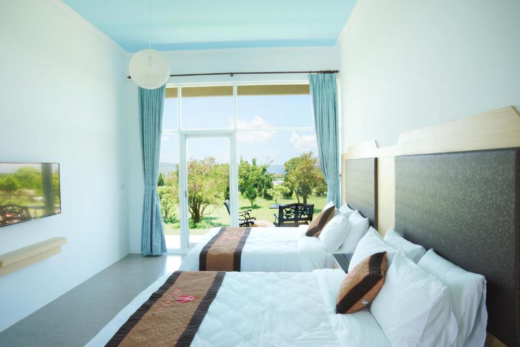 Postelja oz. postelje v sobi nastanitve Coral B&B