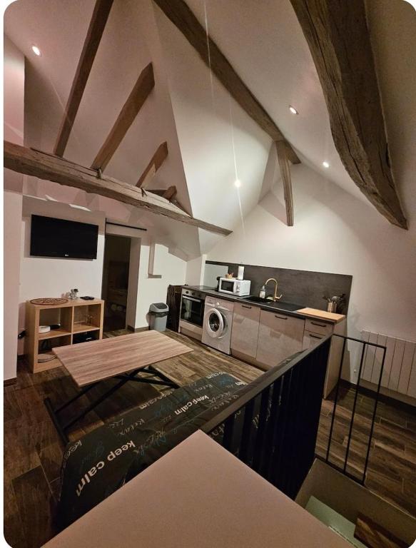 a kitchen with a stove and a counter top at L'appartement Tranquille in Maincy