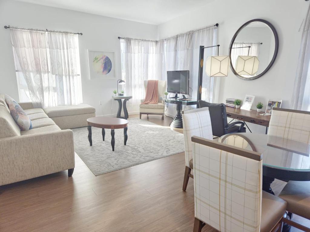 a living room with a couch and a table at Modern Venice Beach Stay - Walk to Marina & Boardwalk in Los Angeles