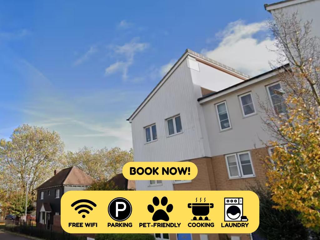 a house with a book now sign in front of it at Colchester Retreat 4br 2bath Ample Street Parking in Colchester