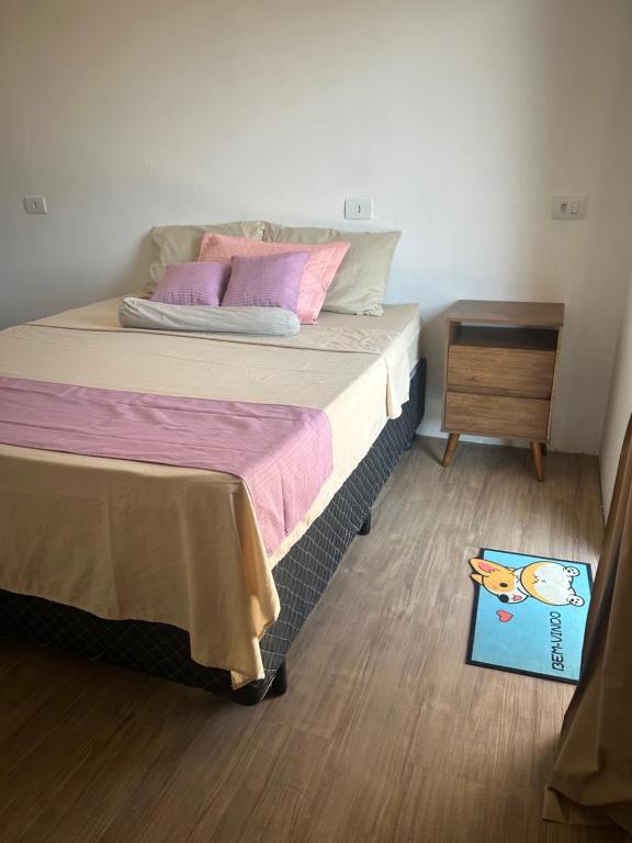 Postel nebo postele na pokoji v ubytování Paraíso das Flores Suíte Confort