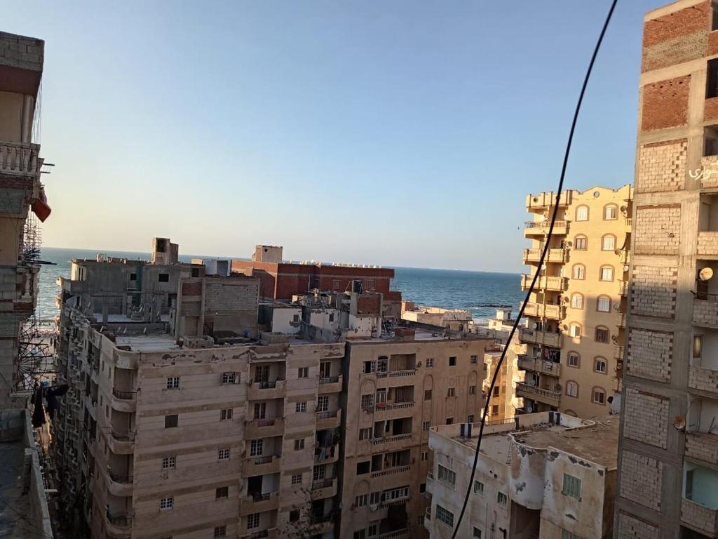 a group of buildings with the ocean in the background at Enjoy 2025 in Alexandria