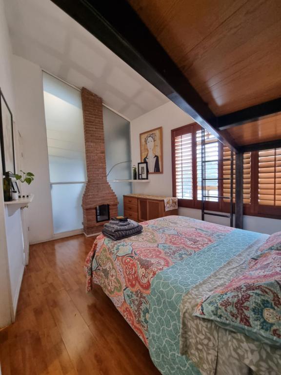 a bedroom with a bed and a brick fireplace at el nido! Private stay at nice apartment North blvd Saltillo Mexico in Saltillo