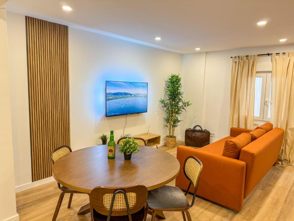 a living room with a couch and a table at El Rinconín - Tu Casa En Gijón in Gijón
