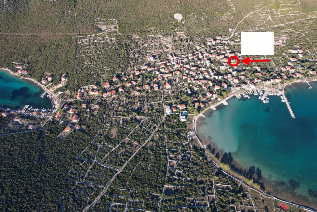 an aerial view of a city next to the beach at Apartments by the sea Ist - 22436 in Ist