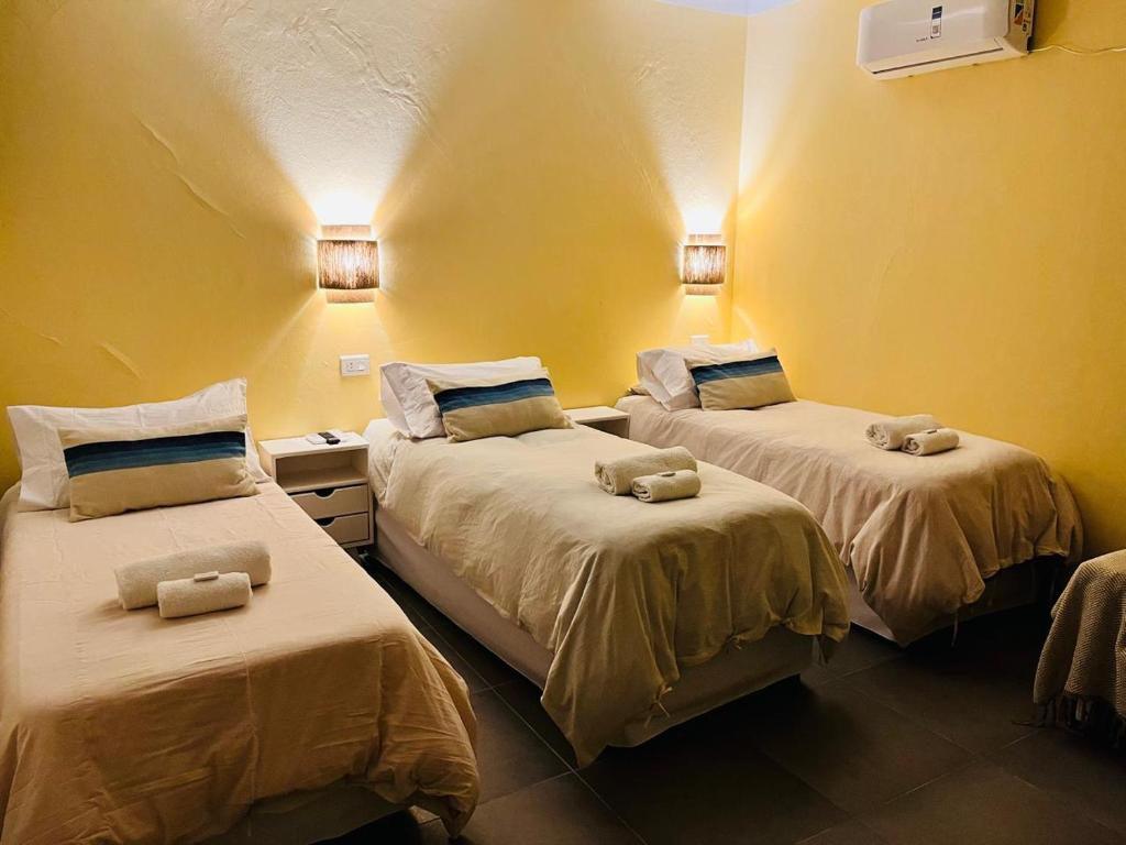 a room with two beds with stuffed animals on them at Patta Tickan in El Peñón