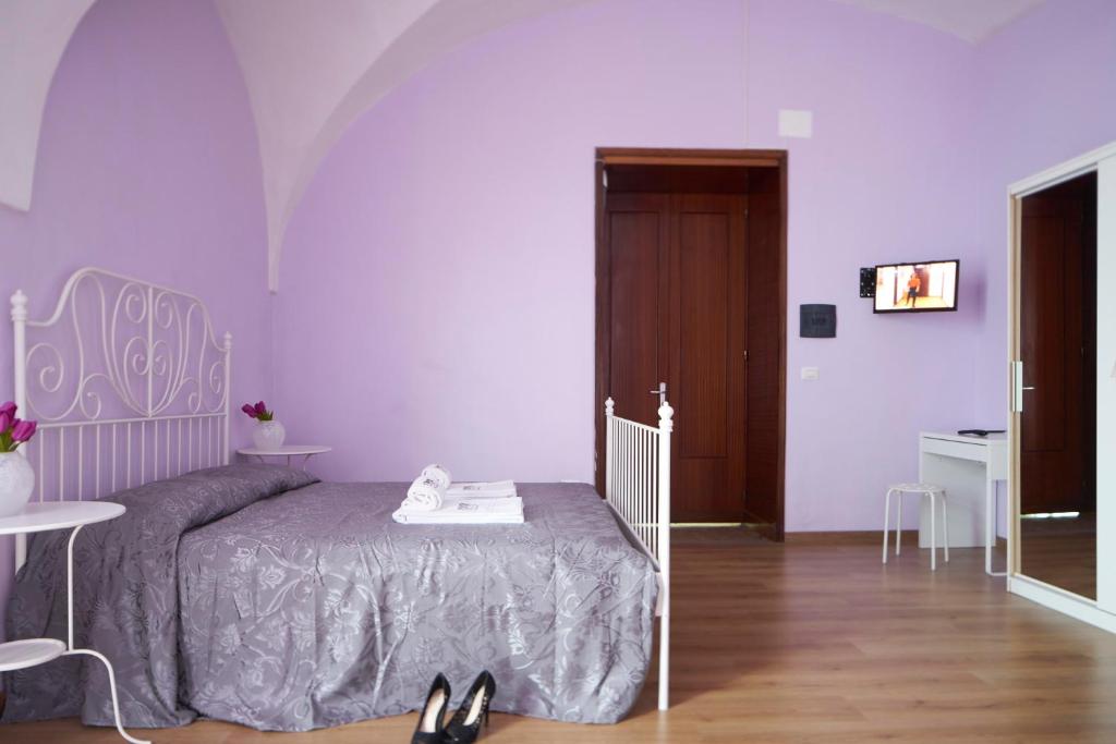 Łóżko lub łóżka w pokoju w obiekcie B&B Favola Mediterranea