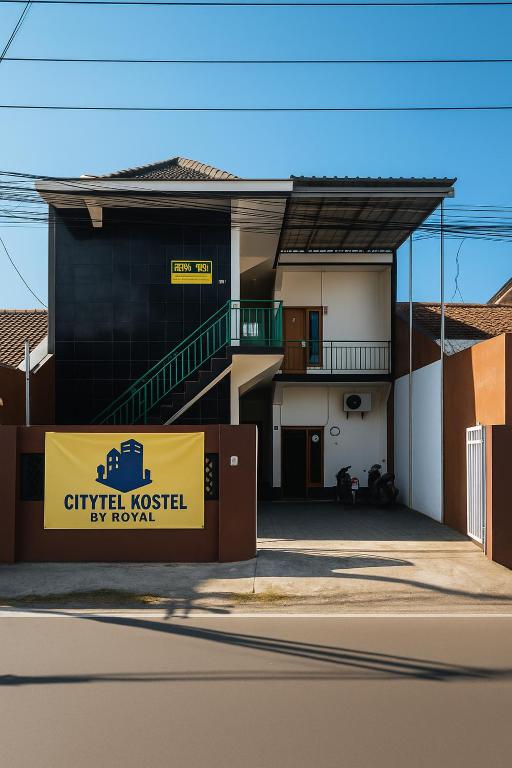 a building with a sign in front of it at Citytel Kostel in Lampung